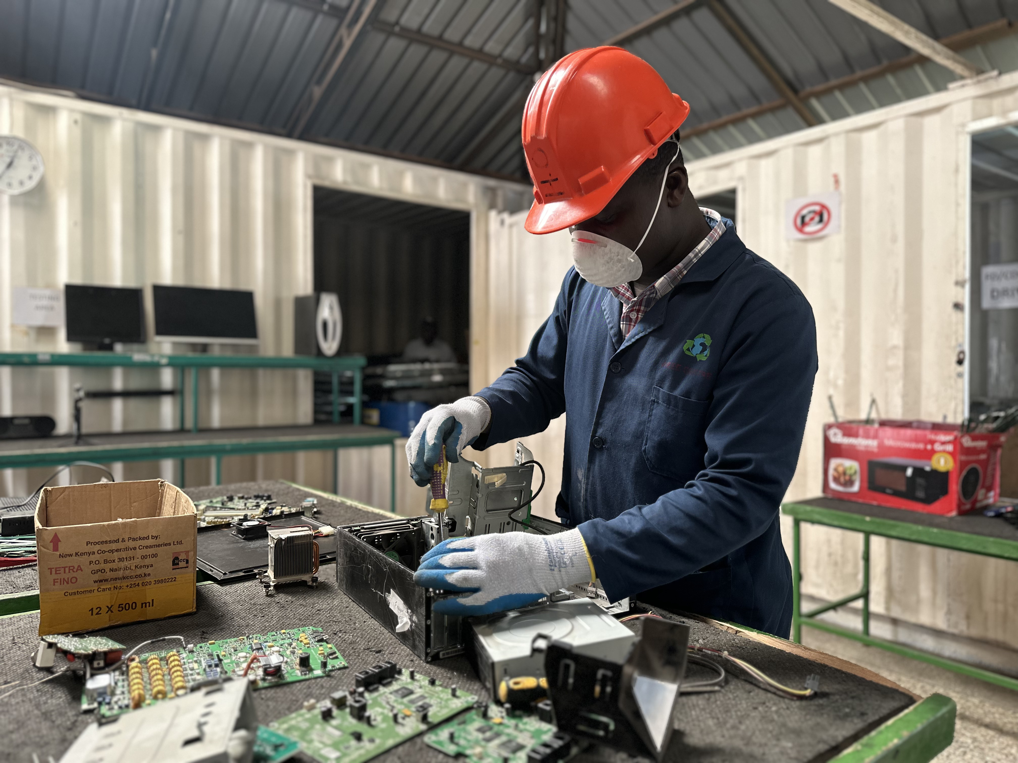 Technician refurbishing a laptop